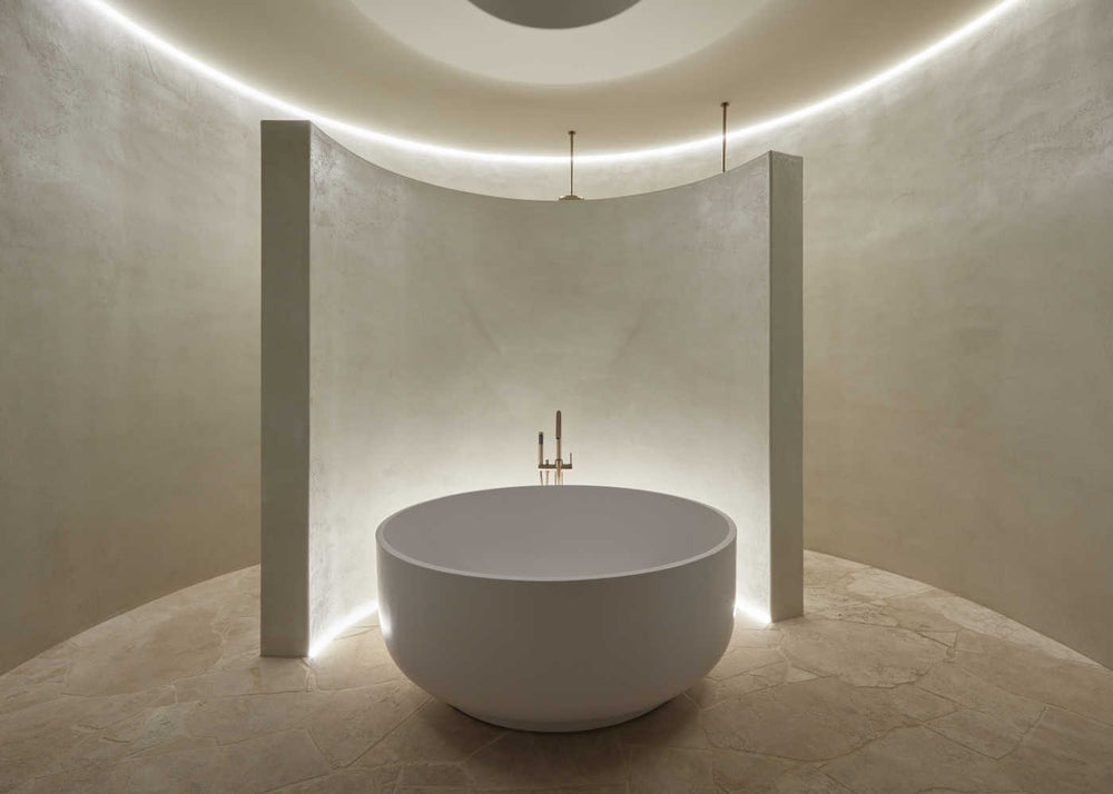 A round stone bath in bathroom