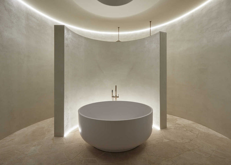 A round stone bath in bathroom